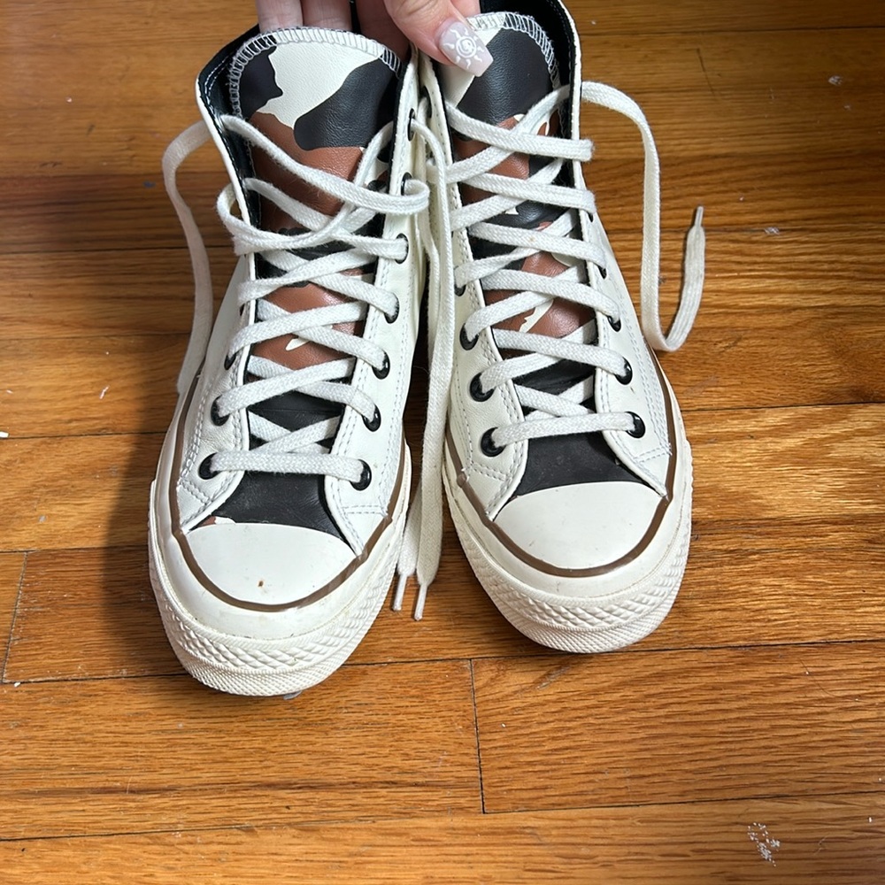 Cow print high top converse